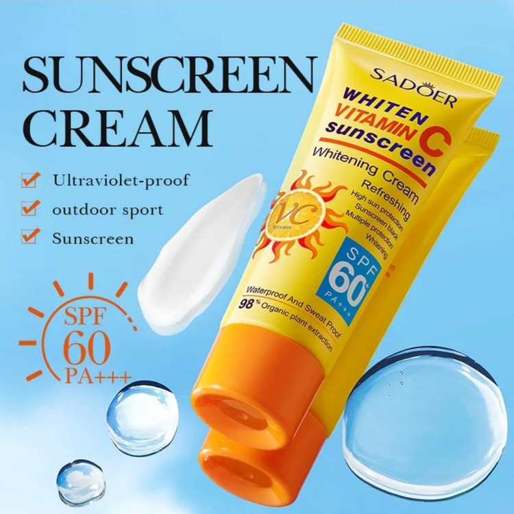 کرم ضد آفتاب بدون رنگ صورت و بدن سادور spf60 مدل ویتامین سی محافظ UVA،UVB مناسب برای انواع پوست وزن 50 گرم